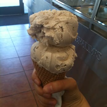 Braum's Ice Cream & Dairy Store - a hand holding a cone of ice cream - Ice Cream & Frozen Yogurt Near Me - Alma, Arkansas