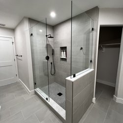 Frameless Glass Shower Enclosure by Century Glass.