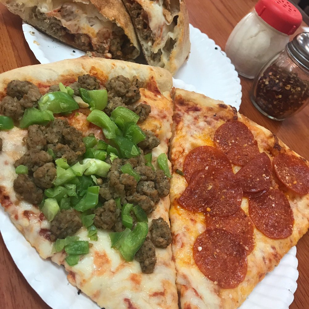 One Guy from Italy University - House calzone (pepperoni, sausage, cheese, and sauce), and two slices. - Pizza Near Me - Lubbock, Texas One Guy from Italy University - House calzone (pepperoni, sausage, cheese, and sauce), and two slices. - Pizza Near Me - Lubbock, Texas