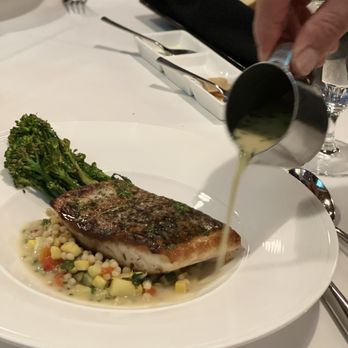 Chez Bacchus - Fish; and the sauce he's pouring was scrumptious. - New American Near Me - Long Beach, California Chez Bacchus - Fish; and the sauce he's pouring was scrumptious. - New American Near Me - Long Beach, California