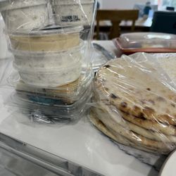 Hummus, yogurt sauce, dolma and pita