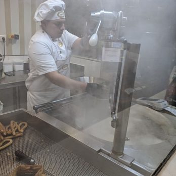 Chocolatería 1902 - The guy making the Churros fresh at the front of the shop. - Breakfast & Brunch Near Me - Madrid, M