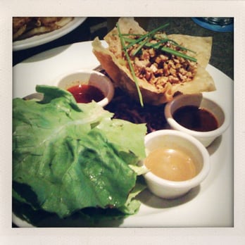 Yard House - Lettuce Wraps Appetizer: stir fried, smoked tofu, pine nuts, green onion, chicken, & 3 sauces. - Bars Near Me - Pasadena, California Yard House - Lettuce Wraps Appetizer: stir fried, smoked tofu, pine nuts, green onion, chicken, & 3 sauces. - Bars Near Me - Pasadena, California