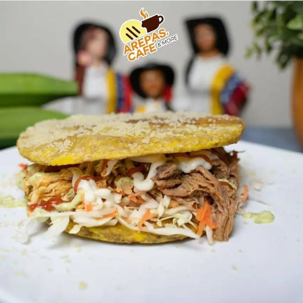 Arepas Cafe & More Logo