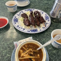 Canton City - Sweet and sour soup, beef skewers, egg drop soup, and tea