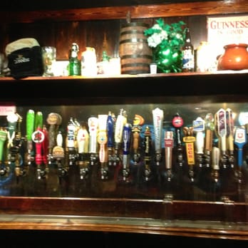 Molly's Pub - a shelf full of beer taps - Pubs Near Me - Conroe, Texas Molly's Pub - a shelf full of beer taps - Pubs Near Me - Conroe, Texas