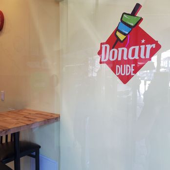 Donair Dude - a table and chairs in front of a window - Mediterranean Near Me - Vancouver, British Columbia Donair Dude - a table and chairs in front of a window - Mediterranean Near Me - Vancouver, British Columbia