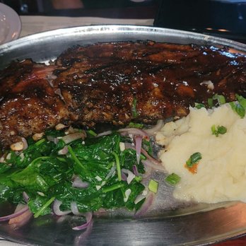 Saddle Ranch - Baby Back Ribs with garlic mashed potato & sauté spinach. - Steakhouses Near Me - Orange, California Saddle Ranch - Baby Back Ribs with garlic mashed potato & sauté spinach. - Steakhouses Near Me - Orange, California