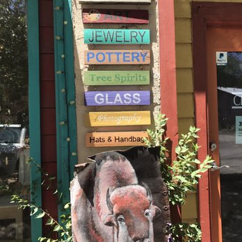 Mostly Madrid - Front door sign, Mostly Madrid. - Jewelry Near Me - Madrid, New Mexico