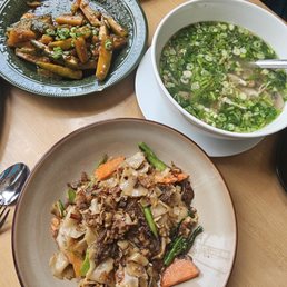 Lemongrass chicken, flat noodles with beef and squash dish Lemongrass chicken, flat noodles with beef and squash dish