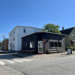 Cute and quirky old building. Street parking and outside benches.