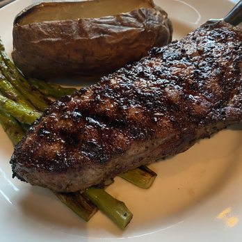Dantanna's - New York long steak with baked potato and asparagus. - Sports Bars Near Me - Atlanta, Georgia