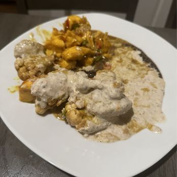 Tassili's Raw Reality - Three item plate with cauliflower and curry plantain. - Vegan Near Me - Atlanta, Georgia Tassili's Raw Reality - Three item plate with cauliflower and curry plantain. - Vegan Near Me - Atlanta, Georgia