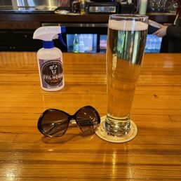 a glass of beer and sunglasses a glass of beer and sunglasses