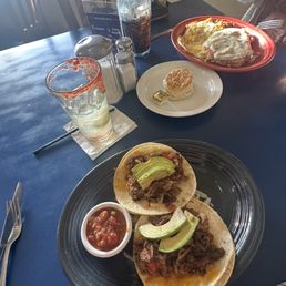 Brisket tacos and chicken fried steak, both delicious