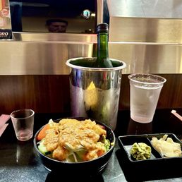 Salad with peanut dressing. And a Nigori sake. Salad with peanut dressing. And a Nigori sake.