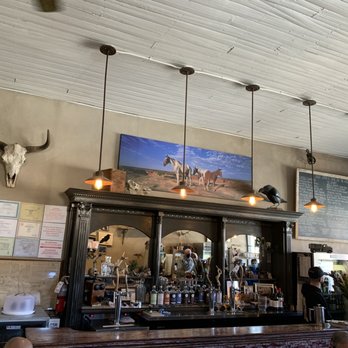 Black Bird Saloon - a bar with a cow skull on the wall - New American Near Me - Los Cerrillos, New Mexico Black Bird Saloon - a bar with a cow skull on the wall - New American Near Me - Los Cerrillos, New Mexico