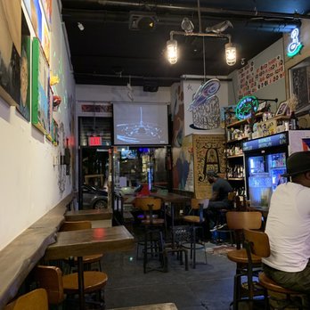 The Sampler - Interior of the bar with a view of some of the local art - Beer Bar Near Me - Brooklyn, New York