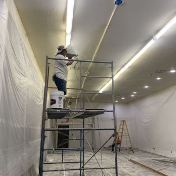 Lone River Drywall - Ceiling in a church being sprayed with orange peel texture. - Drywall Installation & Repair Near Me Lone River Drywall - Ceiling in a church being sprayed with orange peel texture. - Drywall Installation & Repair Near Me