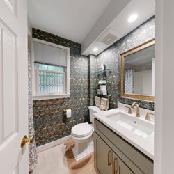 Mayflower Kitchen and Bath - Small space. Big statement.
This powder room remodel blends bold wallpaper, brass fixtures & timeless charm.