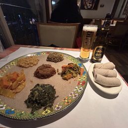 Veggie Combo w/ injera; Habesha Beer. Veggie Combo w/ injera; Habesha Beer.