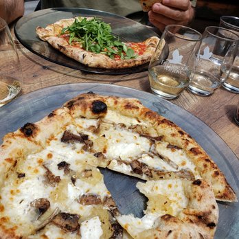 Fieldbrook Winery - Fun Guy pizza in the front and Hot Honey in the back under all that arugula. - Wineries Near Me - McKinleyville, California