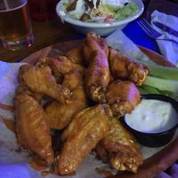 A dozen of medium wings and house salad A dozen of medium wings and house salad