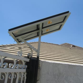 Nava Ornamental & Iron - Backside view of custom wrought iron mount for the dual 15w solar panels - Fences & Gates Near Me - Ontario, California Nava Ornamental & Iron - Backside view of custom wrought iron mount for the dual 15w solar panels - Fences & Gates Near Me - Ontario, California