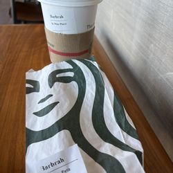 Starbucks - My black coffee and Spinach, Feta & Egg White Wrap- with my name(?)- Reminded me of Hawaii. If you know, you know haha!
