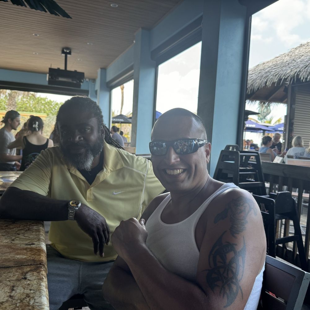 Me and my friend Rob sitting at the outside bar Me and my friend Rob sitting at the outside bar