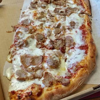 Liquori's Pizza - Liquori's take on a slice of pizza,  more like half a pie for $3.25 incl. tax. Wow!!! - Pizza Near Me - West Springfield, Massachusetts