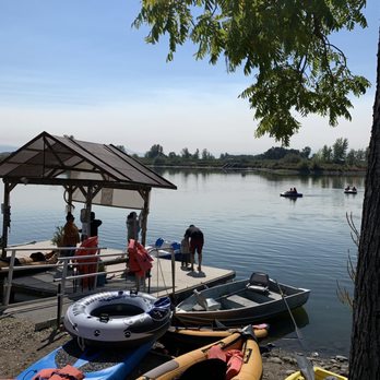 Rogue Jet Boat Adventures - a group of kayaks docked at a dock - Boat Tours Near Me - Central Point, Oregon Rogue Jet Boat Adventures - a group of kayaks docked at a dock - Boat Tours Near Me - Central Point, Oregon