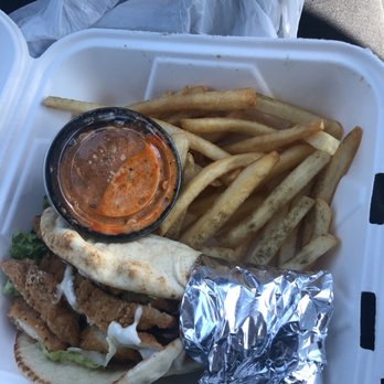 Mim's Mediterranean Grill - Crispy Chicken Gyro w/ fries & a side of Fiery Feta Sauce - Greek Near Me - Petoskey, Michigan Mim's Mediterranean Grill - Crispy Chicken Gyro w/ fries & a side of Fiery Feta Sauce - Greek Near Me - Petoskey, Michigan