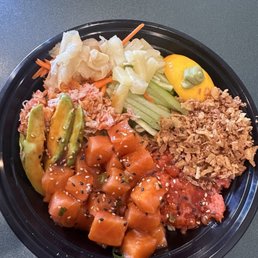 Poke bowl with salmon and spicy tuna.