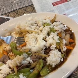 Puukaow Thai Restaurant - Thai basil stir fry level 3 with steamed rice and beef.