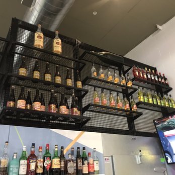 Native Son - Higher wall decor of liquor - Cocktail Bars Near Me - Rancho Cucamonga, California Native Son - Higher wall decor of liquor - Cocktail Bars Near Me - Rancho Cucamonga, California