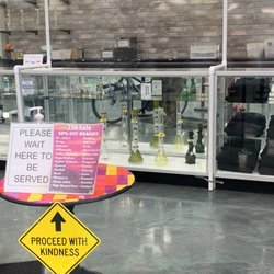The Green Planet Vape and Glass - Glass cases and waiting area