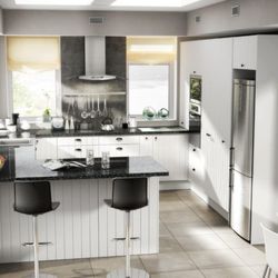 Kitchen Cabinets and Stones - Euro range, Arctic White style cabinets with breakfast bar.