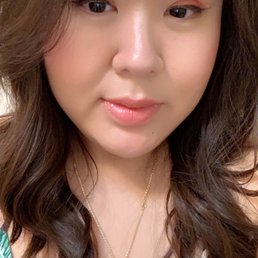 Long face framing bangs with medium cut layers