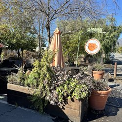 Outside sign and patio seating 2-8-25