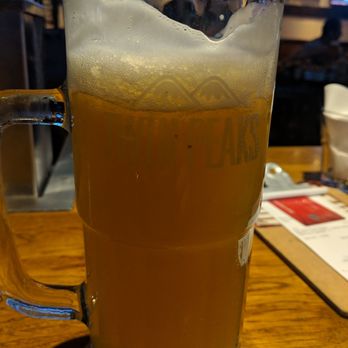 Twin Peaks - Yeah...sure..."22oz" After the 3 inch foam is gone and a layer of ice is now in the glass.  That's not beer.  I don't know what it is. - Sports Bars Near Me - Orlando, Florida
