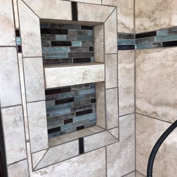 Isaiah Thoms Remodeling - a shower with a shower head - General Contractors Near Me
