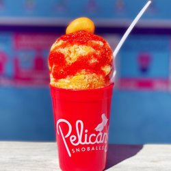 Pelican's SnoBalls - Woodfin - Our chamango snoball!
Mango snoball topped with tajin, chamoy and a spicy mango gummy!