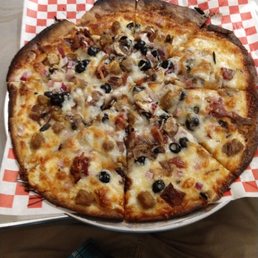 My burnt pizza from Flat Rock Pizza. It was about as hard as a flat Rock and didn't taste much better My burnt pizza from Flat Rock Pizza. It was about as hard as a flat Rock and didn't taste much better