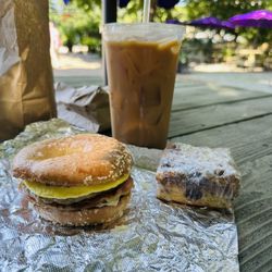 Jitters Cafe - Salt bagel with bacon, sausage, cheese and egg with a large house-blend coffee and a blueberry crumble cake