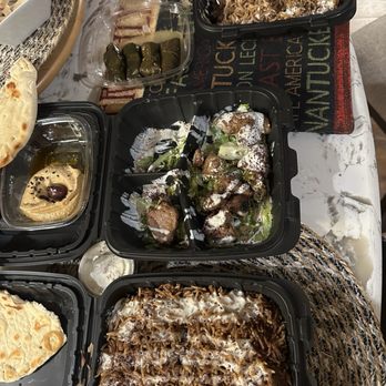 Kebabs-To-Go - Two lamb kebabs, 2 brown rice, 1 order of dolmas, and bread and hummus - Mediterranean Near Me - Dallas, Texas Kebabs-To-Go - Two lamb kebabs, 2 brown rice, 1 order of dolmas, and bread and hummus - Mediterranean Near Me - Dallas, Texas