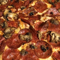 Domino's Pizza - Brooklyn style crust, pepperoni/mushroom/extra sauce:)