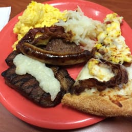 So good pork steak grits on top, breakfast pizza, eggs w/ syrup & ketchup . Also had 3 omelets so good!