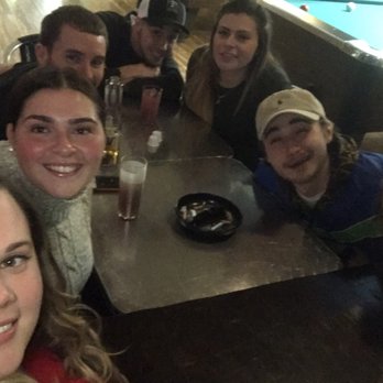 Bull Tavern - a group of people sitting around a pool table - Bars Near Me - Croydon, Pennsylvania