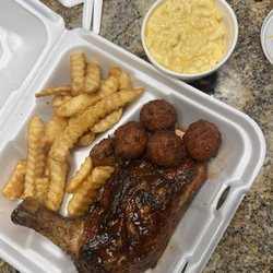 Bbq chicken, fries, hush puppies, mac and cheese